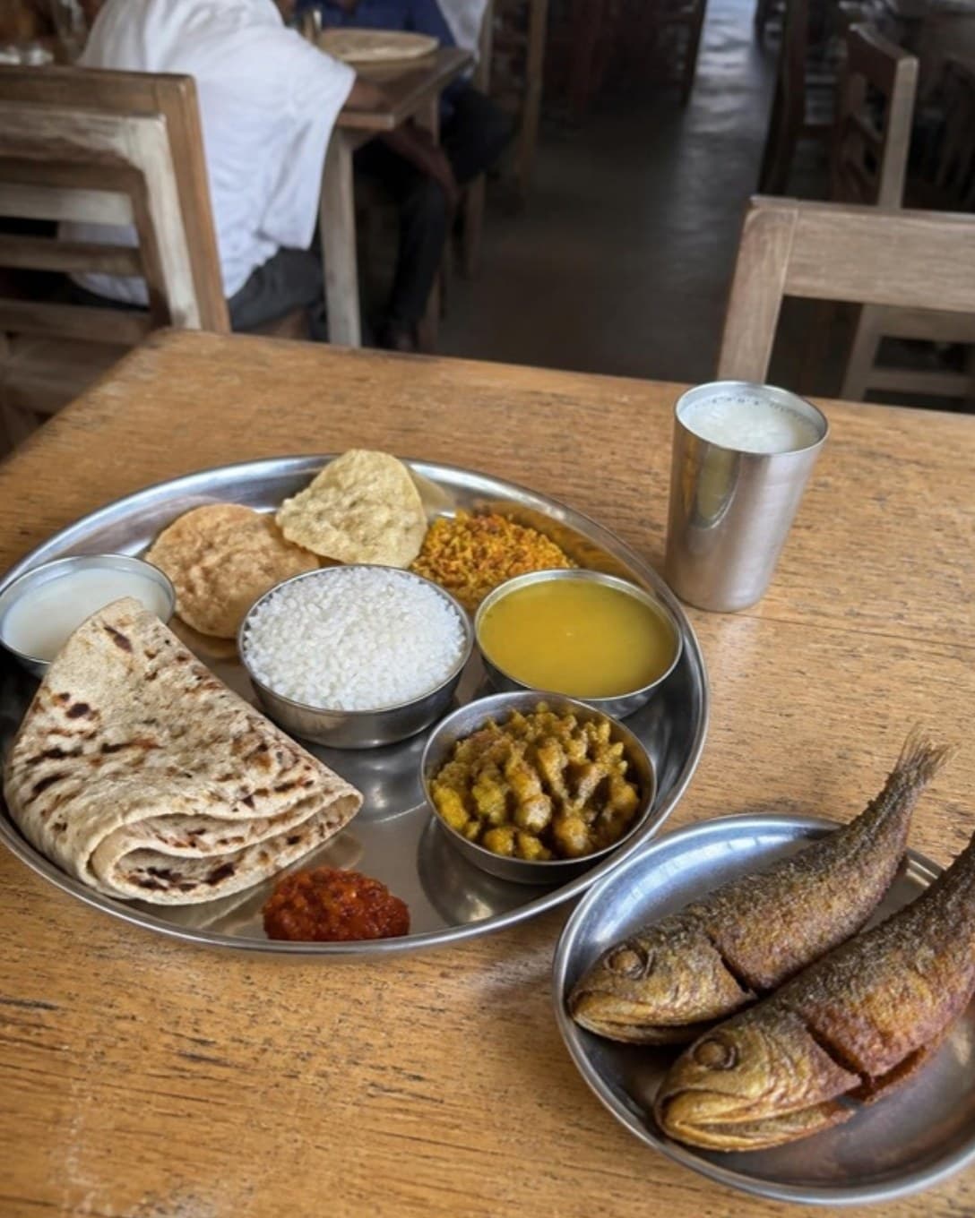 Gujarati thali and fried fish served at a coastal town restaurant